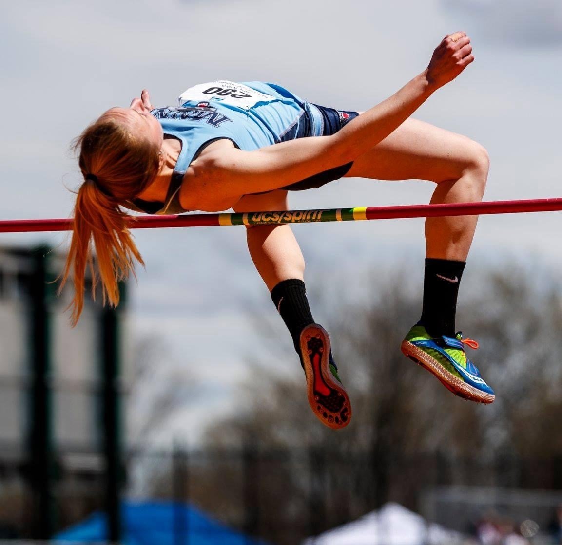 Grace Slattery clearing the bar in the high jump.