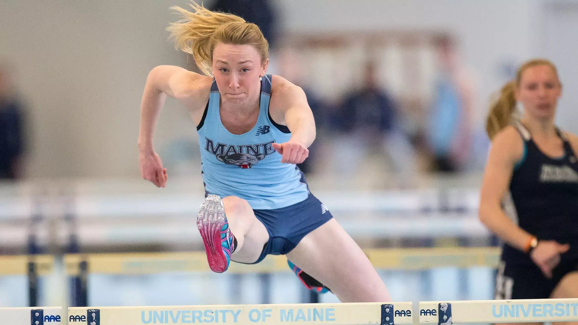 Grace Slattery hurdling at the University of Maine.
