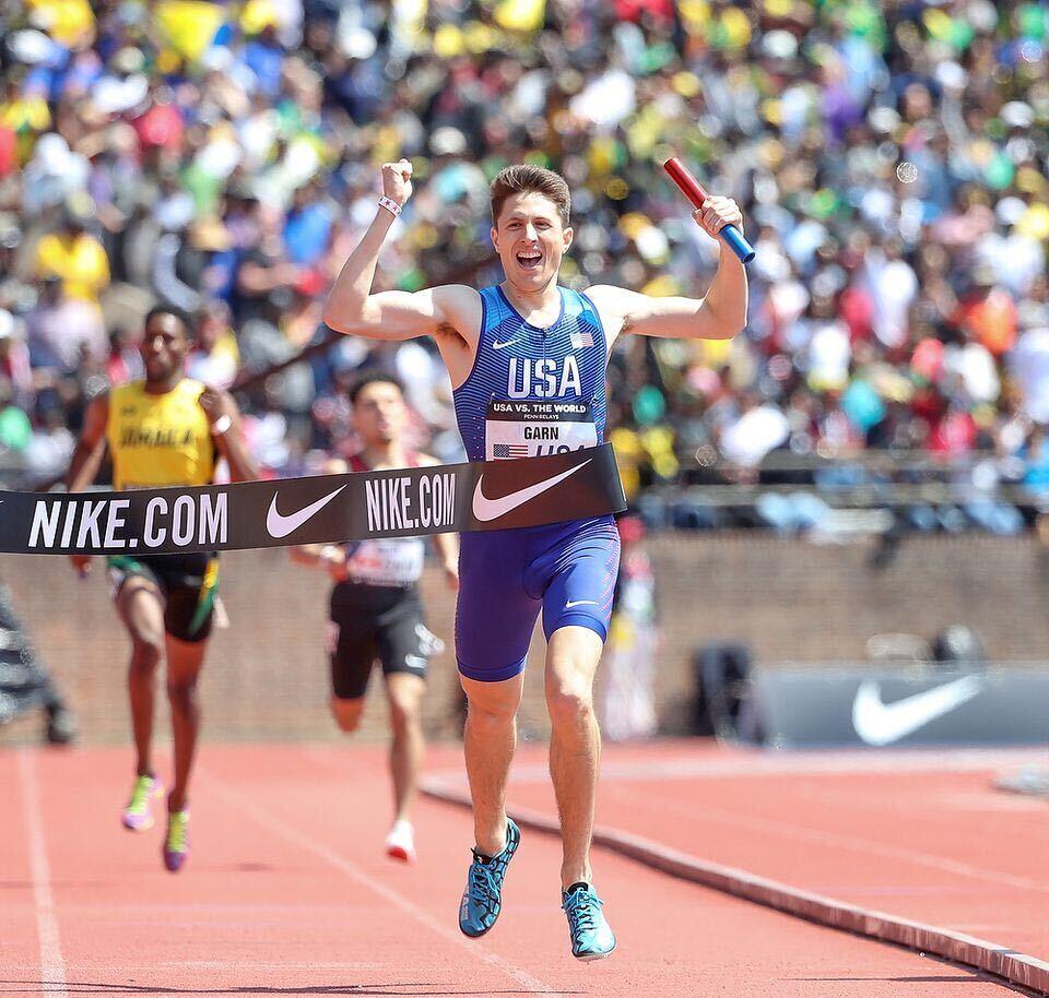 Dr. Jesse Garn running for Team USA winning the Penn Relays Sprint Medley Relay